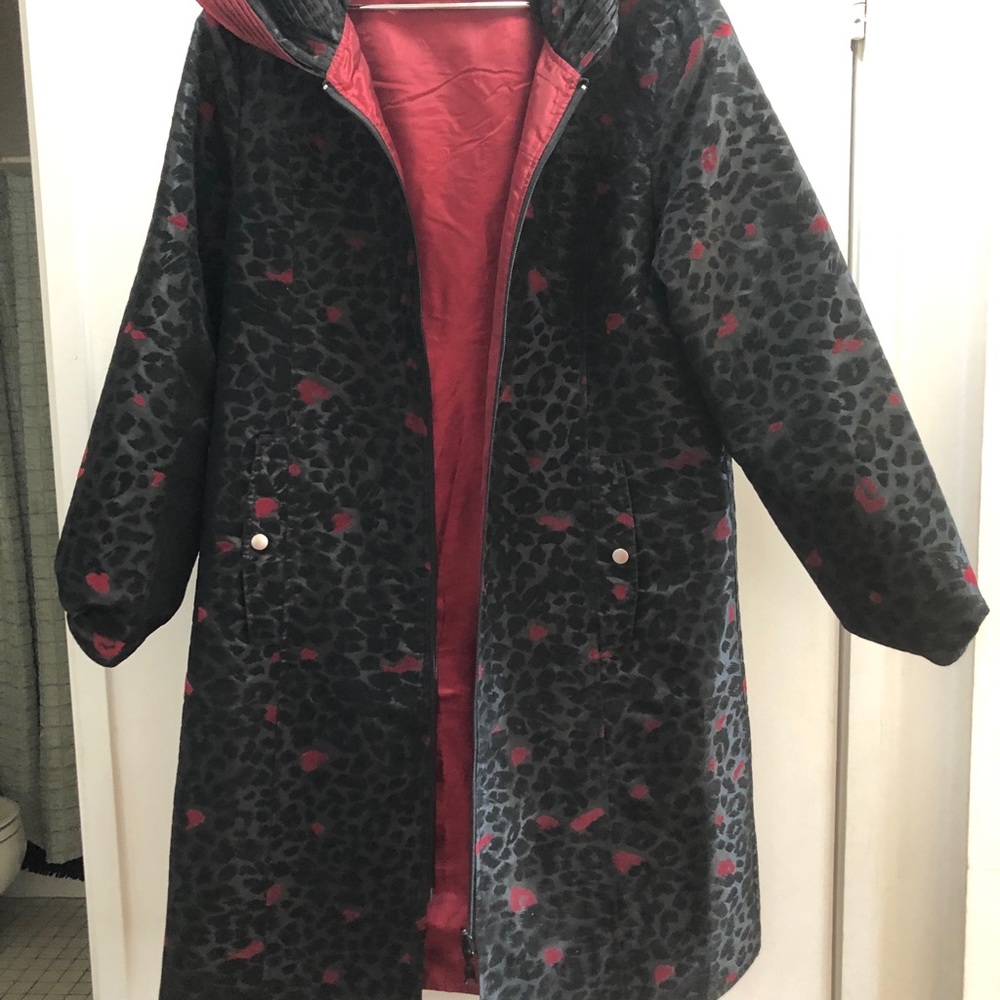 reversible raincoat, w two side pockets and a hood.